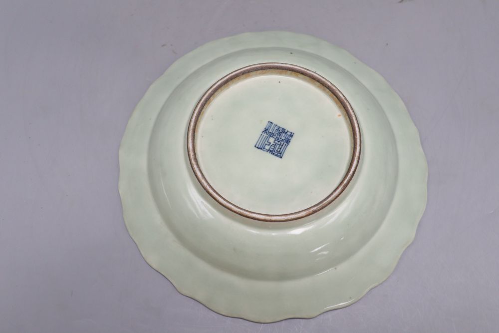 A Chinese celadon glazed bat and shou medallion dish, Qianlong mark but 19th century